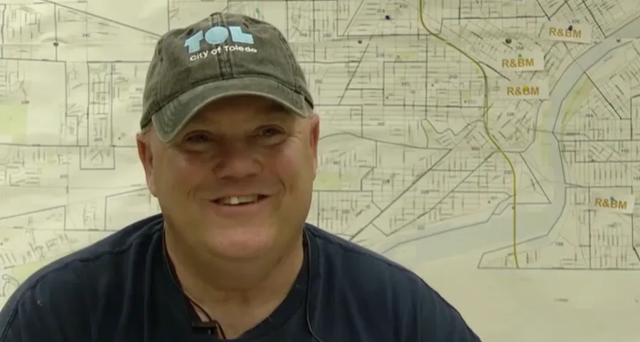 Photo of middle-aged white man in City of Toledo cap and similing during an interview. Photo credit: Channel 13 WTVG News